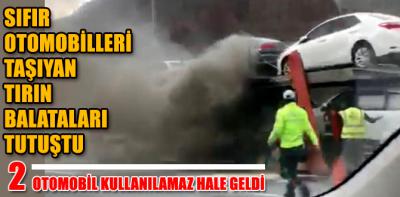 Balataları tutuşan TIR'ın dorsesindeki otomobiller zarar gördü