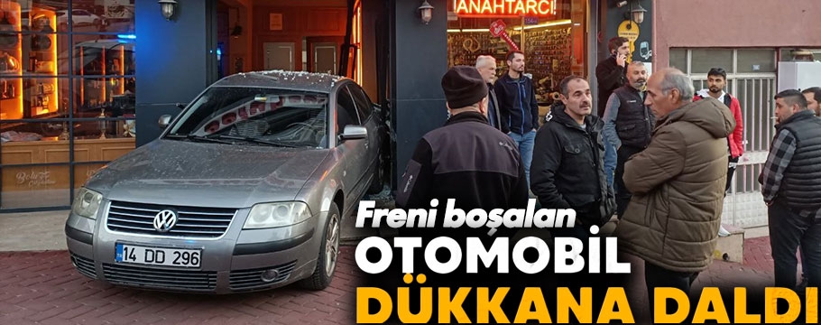 Freni boşalan otomobil dükkana daldı